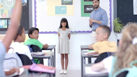 animation of school days text over diverse schoolchildren learning with male teacher