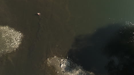 flying above glistening waters of zumbro river in oronoco, minnesota, usa