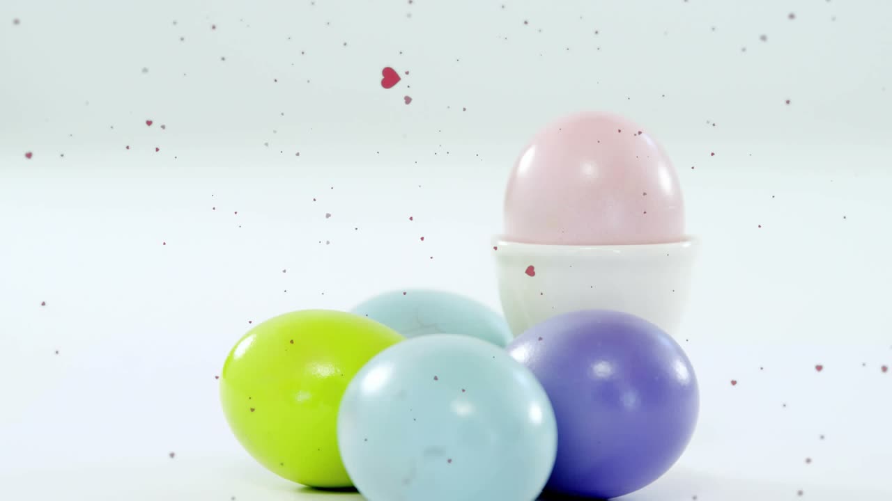 Timed entrance revealing pastel eggs settling on white table, heart confetti drifting for marketing