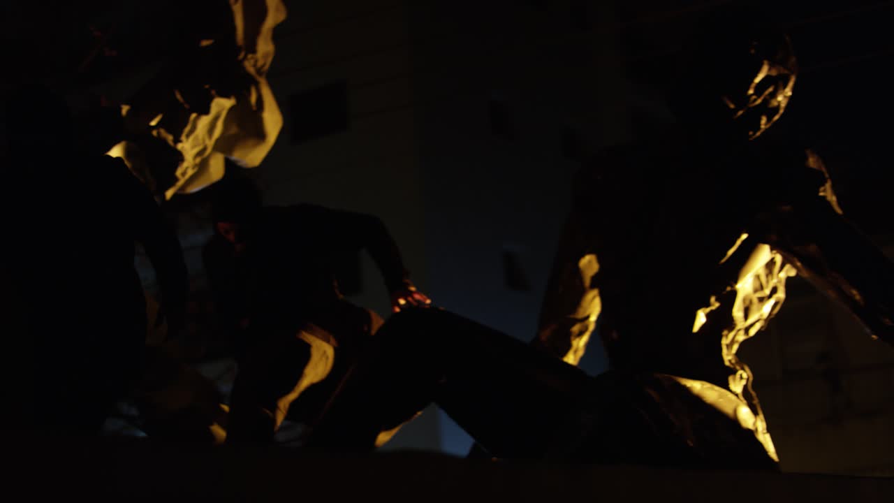 Two masked men wearing fully covered clothes trying to escape. Static.Concept of robbers and thieves.