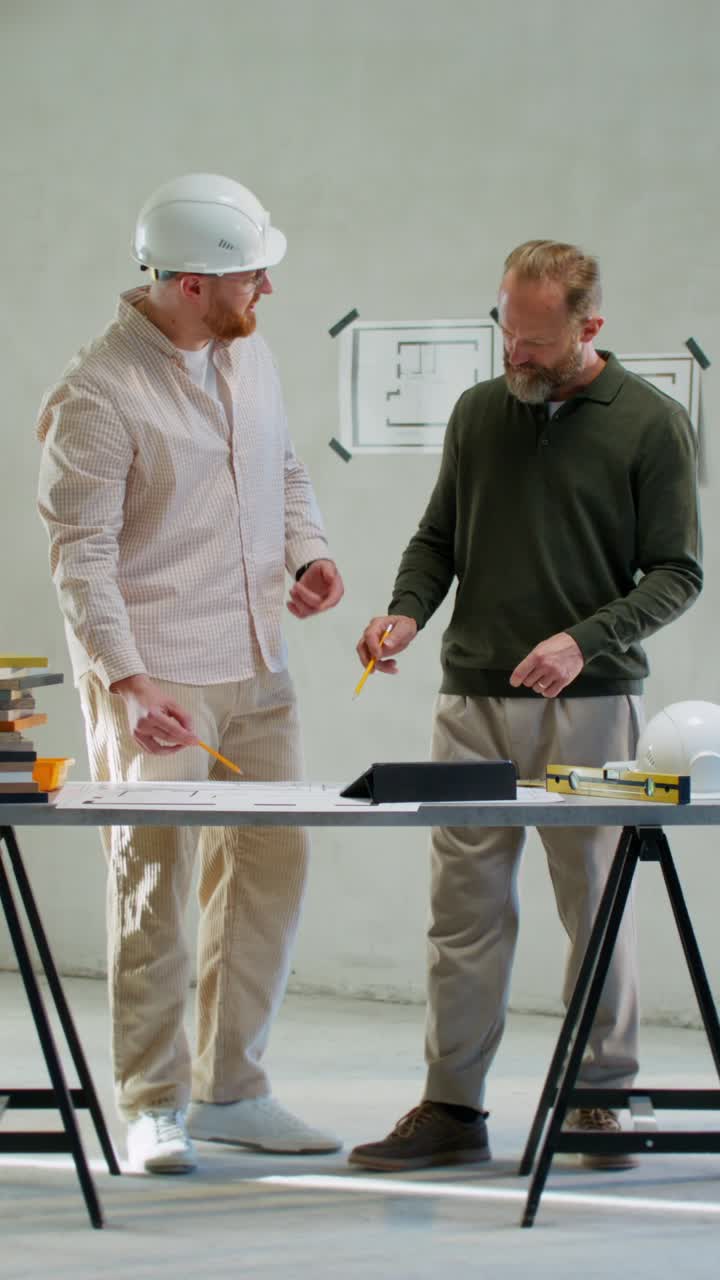 Construction Team Discussing Architectural Plans