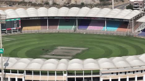 aerial view over empty national cricket stadium in karachi