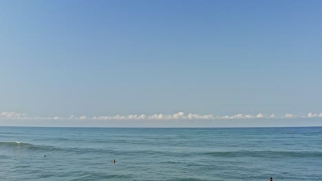 Beautiful-travel-landscape,-aerial-view-of-surfers-relaxing-in-tropical-ocean