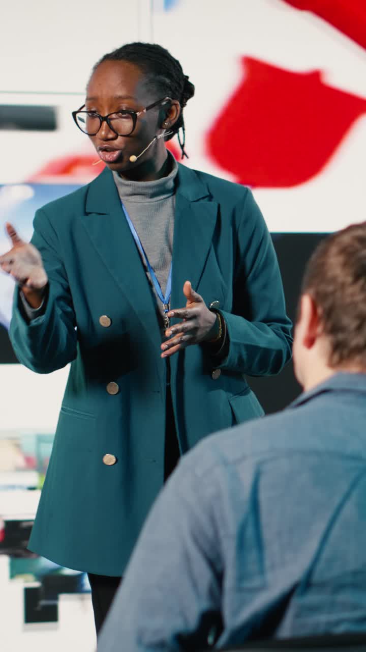 Vertical Video African American female speaker delivers powerful media presentation