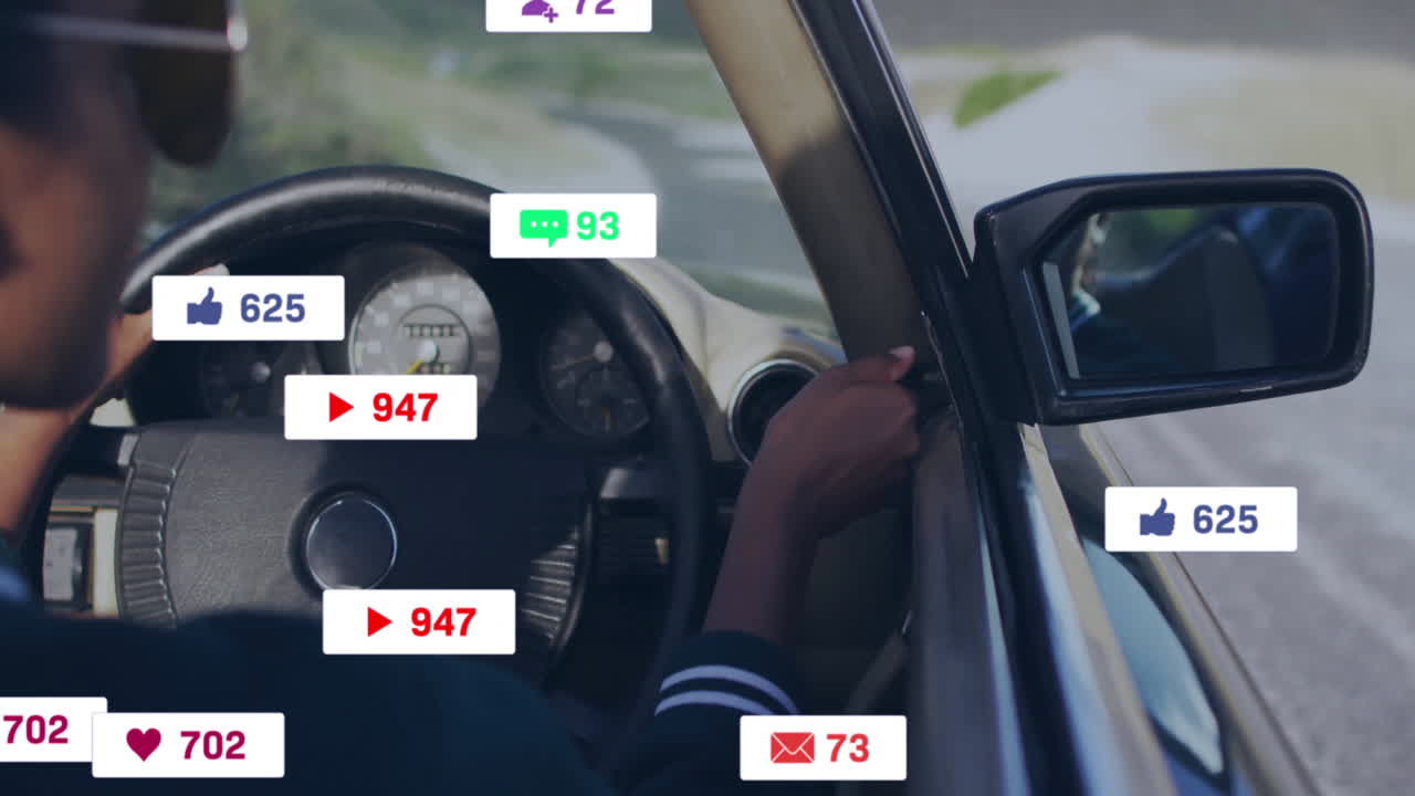 Driving car, person surrounded by animation of social media notifications popping up