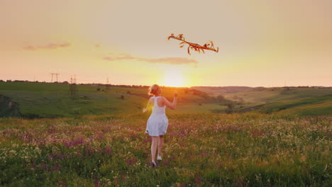 A-Carefree-Happy-Woman-Running-With-A-Snake-In-A-Picturesque-Place-At-Sunset-Happy-Moments-Of-Life-4