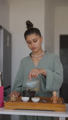 woman pouring tea during tea ceremony