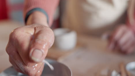 Hands,-pottery-clay-or-wet-sponge-for-creative