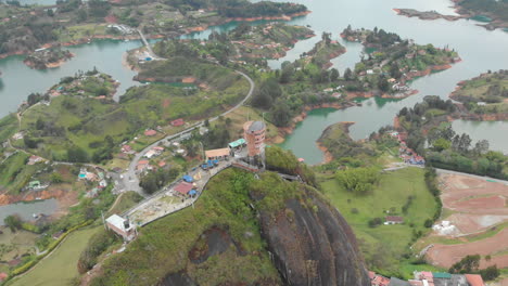 Guatape-Rock-Lookout-Point-Piedra-Del-Penol-in-Colombia---aerial-drone-shot