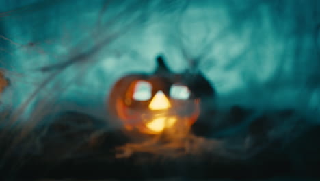 spiderweb and glowing pumpkin