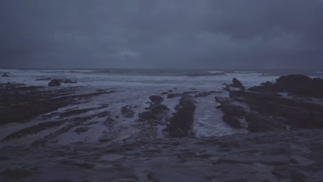 view of rough sea in the coast of devon england uk during dark day