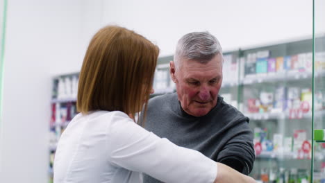 pharmacist checking blood pressure