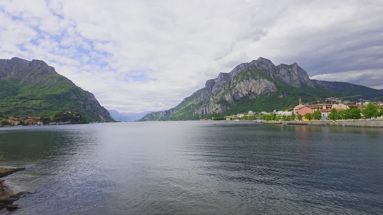 A nice stationary panoramic view of lake Como in Italy. The clouds make for a nice, even light over the whole scene.