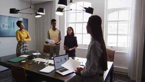 Group-of-diverse-businesswomen-in-discussion-at-office-meeting