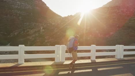 sporty mixed race man with prosthetic leg hiking