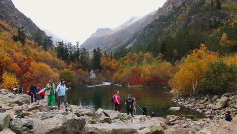 autumn hiking in the mountains by a lake