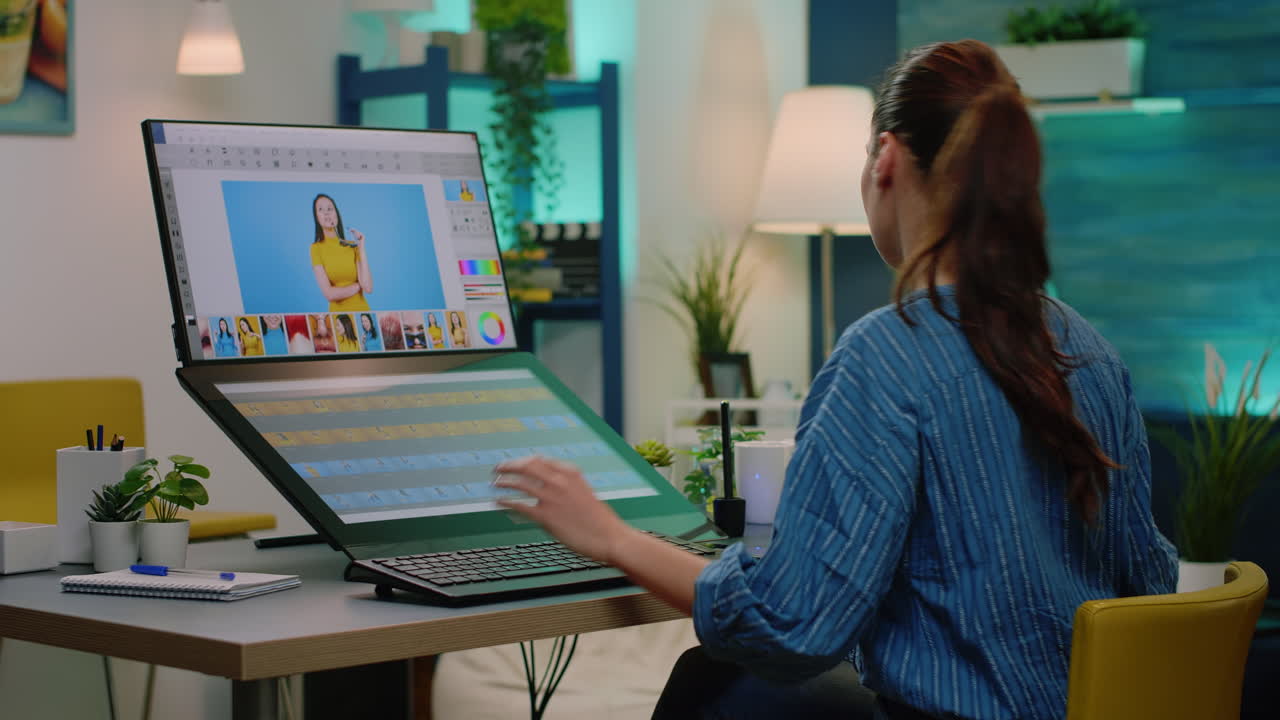 Retouch artist working with editing software on touch screen