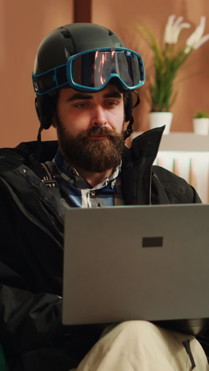 Vertical Video Person checks webpage on laptop