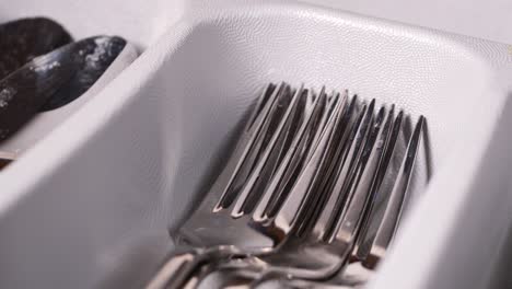 cutlery fork with knife and spoon in a drawer ,