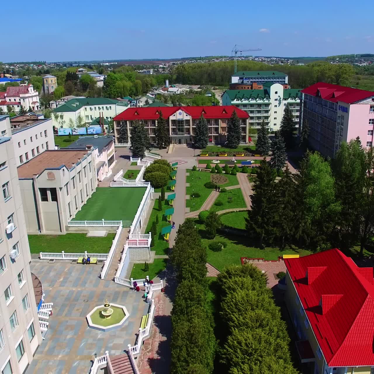 Beautiful new colorful buildings with well-kept area of the yard. Sunny day footage over the city