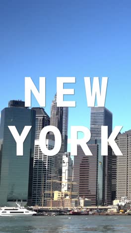 Vertical-Video-Shot-Of-Manhattan-Buildings-And-Skyline-In-America-Overlaid-With-Animated-Graphic-Spelling-Out-New-York