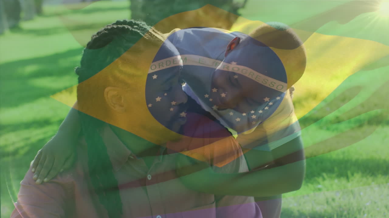 animación de la bandera de brasil sobre padre afroamericano con hijo