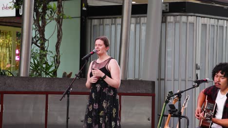 two musicians performing together outdoors