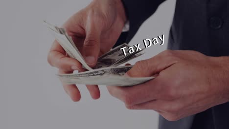 animation of tax day text over caucasian man holding banknotes