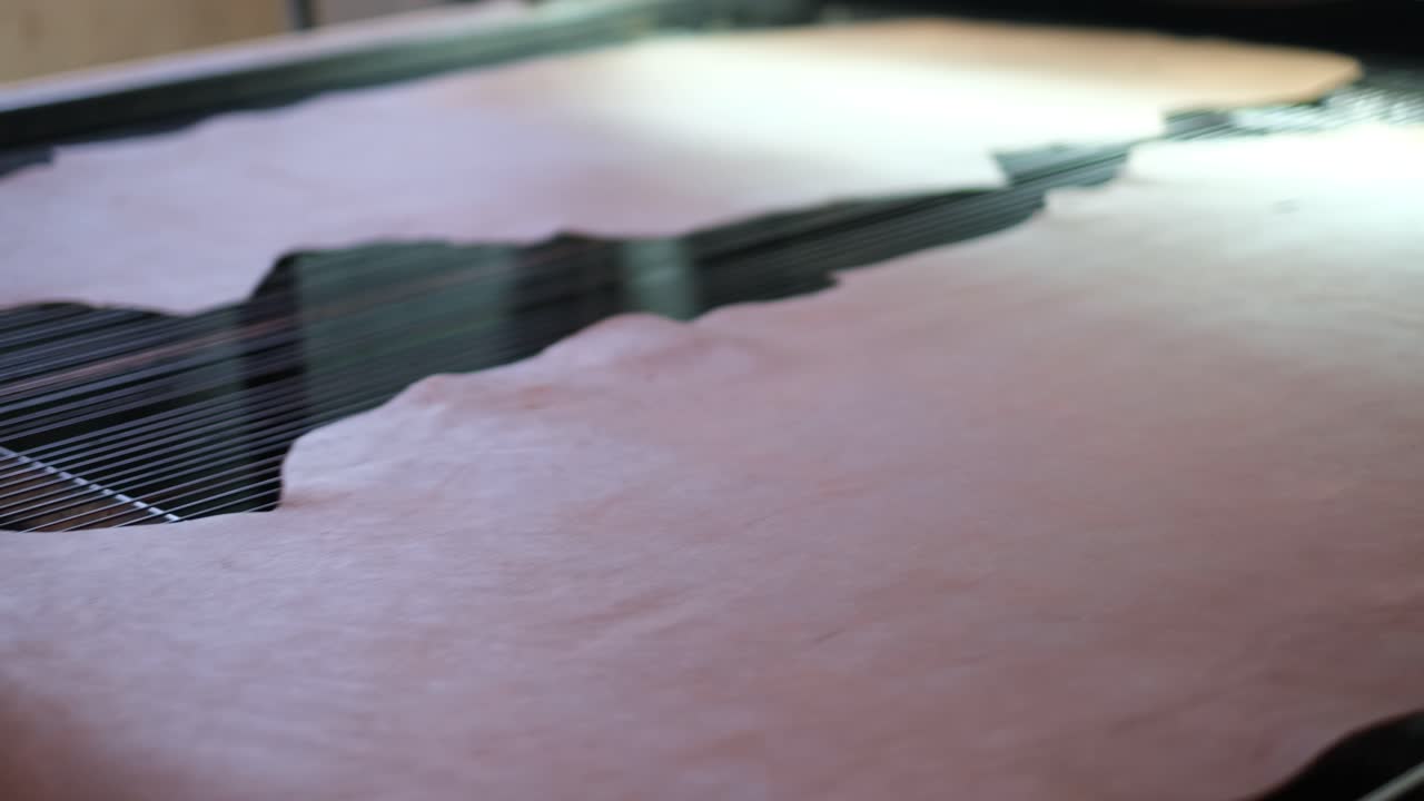 Leather Placed On Electronic Measuring Machine In A Tannery In Ethiopia, Africa. - closeup shot