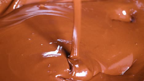 smooth melted chocolate stirred with a spoon