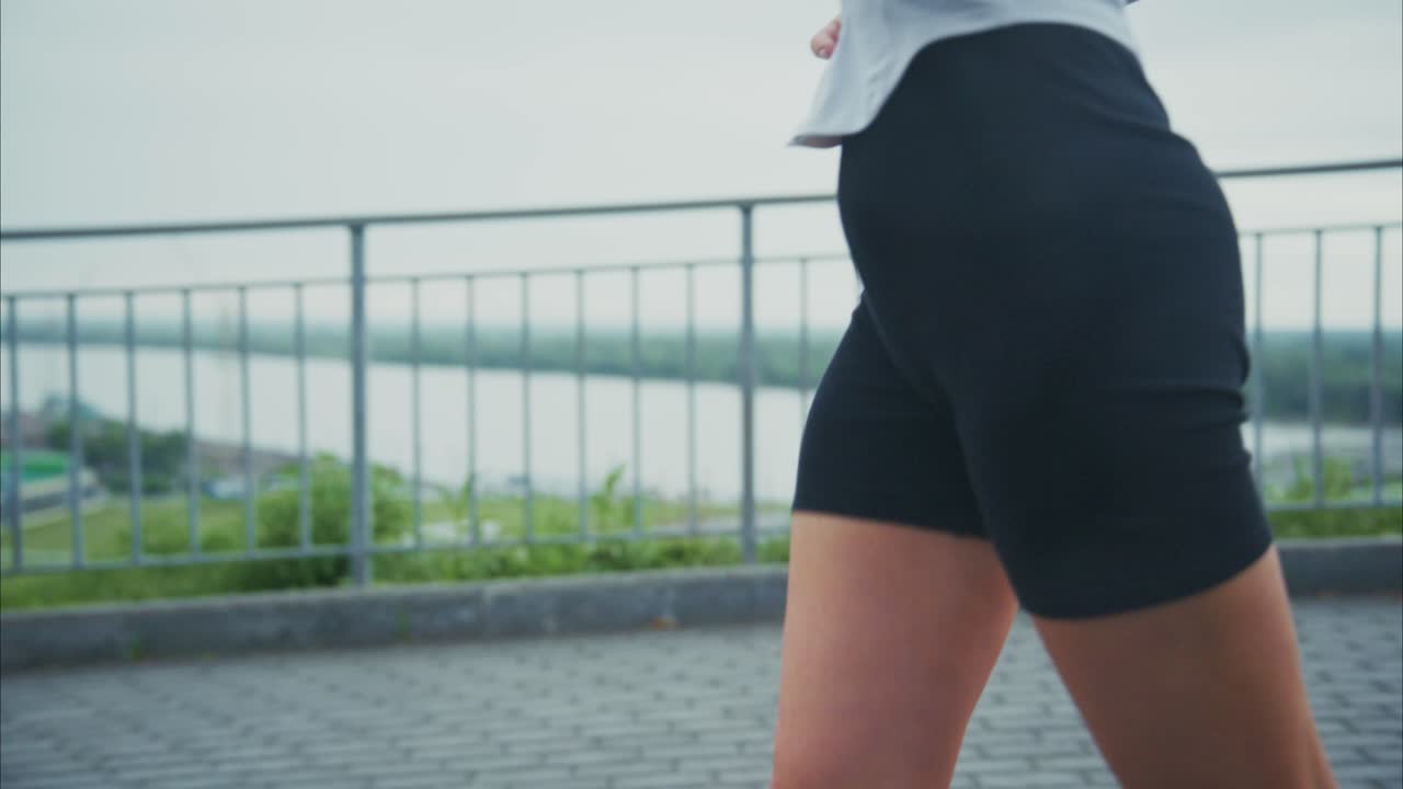 A woman running outdoors for fitness