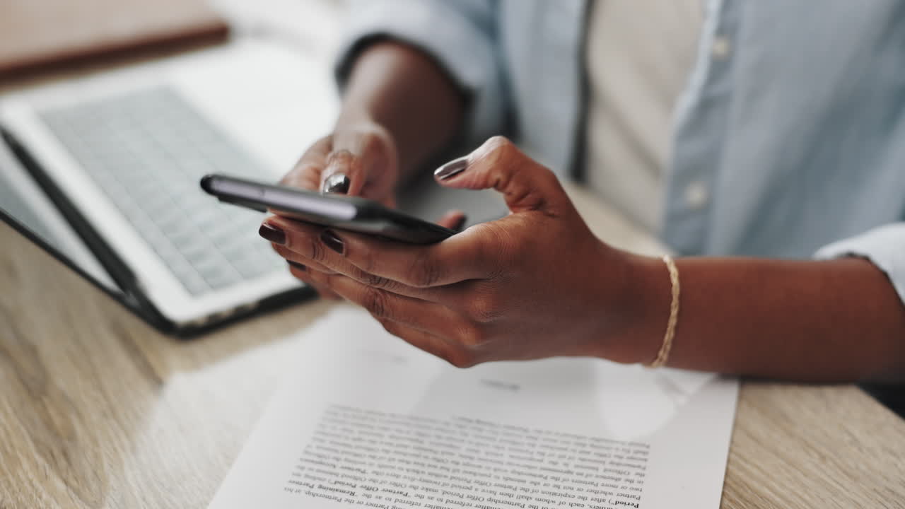 Woman using smartphone in office