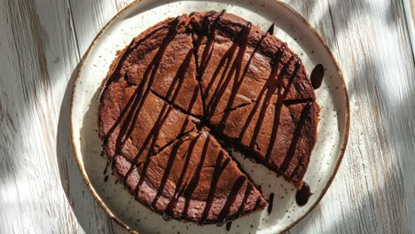 Delicious-Chocolate-Cake-with-Drizzled-Chocolate-Topping-on-Wooden-Table