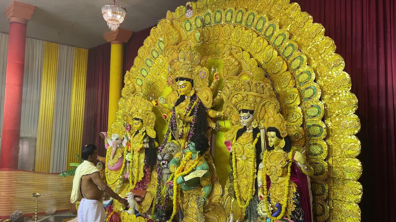 An Indian priest offering prayers to Goddess Durga in oldest pandal in Kolkata.