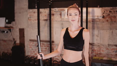 Handheld-Shot-Of-Determined-Young-Female-Athlete-At-Health-Club-3