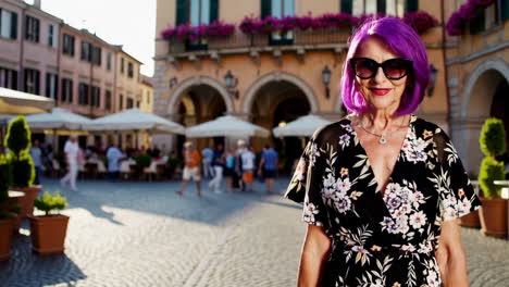 stylish woman with purple hair in european town square