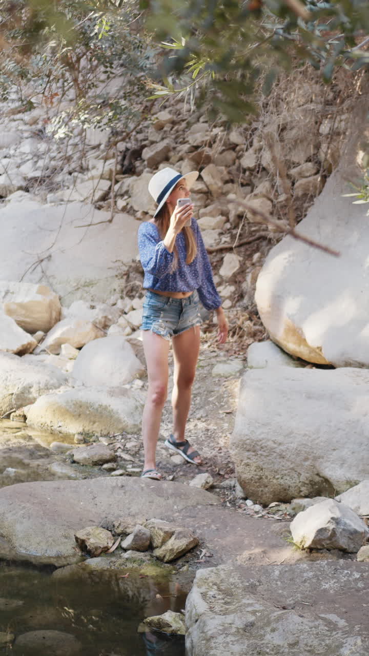 Woman taking photo in nature