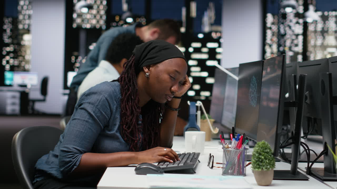 Tired African American Woman Working Late Night in Modern Office