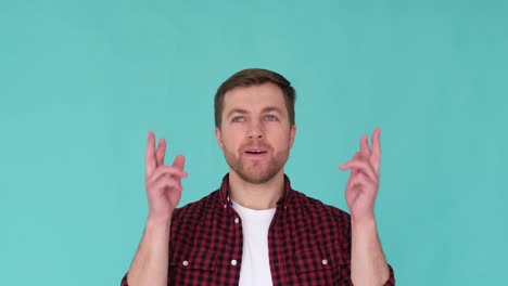 calm positive guy meditates and enjoys calm positive guy meditates and enjoys video studio shooting on a blue background meditation as a lifestyle stress relief