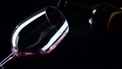 red wine pouring into a wine glass