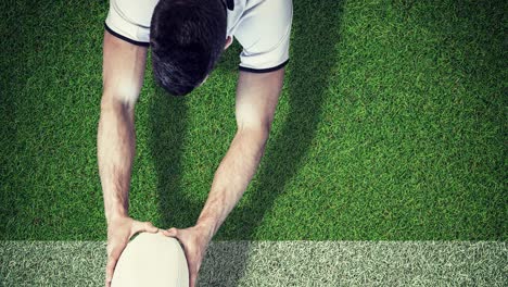 animation of caucasian male rugby player holding ball over stadium