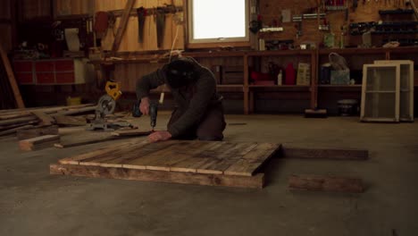 Portrait-Of-A-Man-Doing-Woodworks-Inside-Workshop