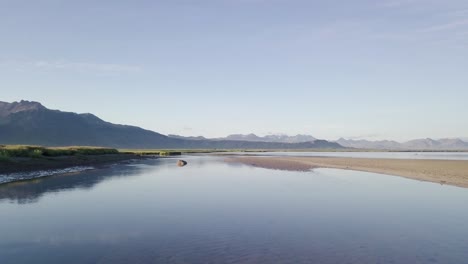 Low-Flight-Over-the-Sandy-River-Bank-During-Sunny-Summer-In-Snaefellsness-Peninsula,-Iceland