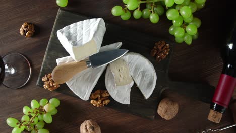 camembert cheese on cutting board rotates slowly.