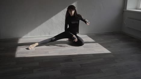 woman stretching in a studio