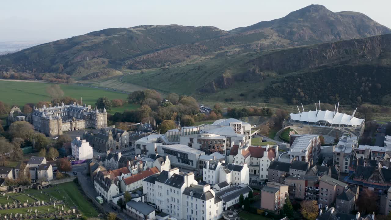 Incredible drone shot of Holyrood Scottish Parliament, The Queen's Palace, Dynamic Earth, Arthur's Seat and the Crags | Edinburgh, Scotland | 4K at 30fps
