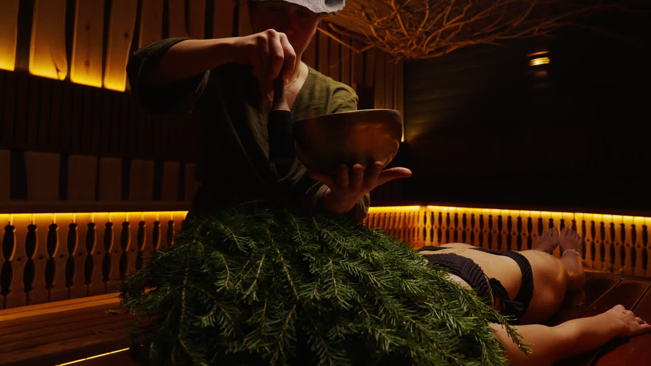 Woman receiving sound healing session in a spa