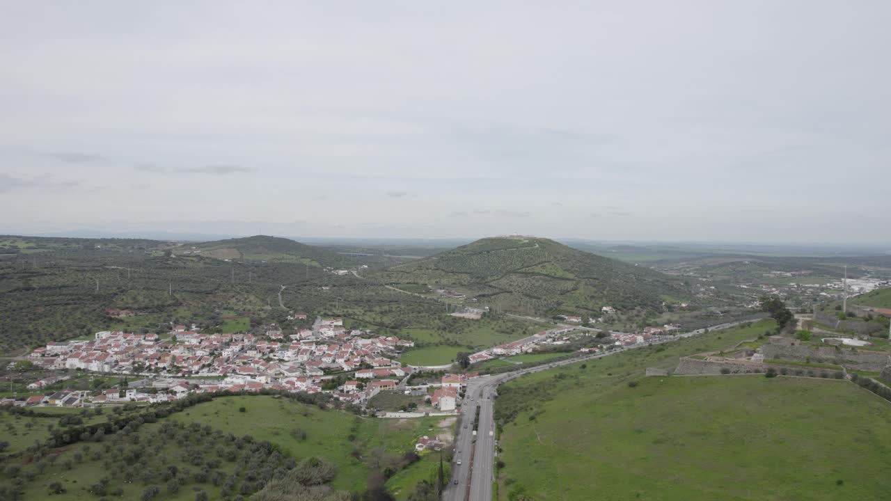 Drone - hillside village and surrounding olive groves in Portalegre Portugal