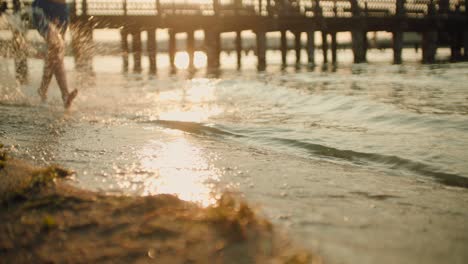 kid running on the beach slow motion