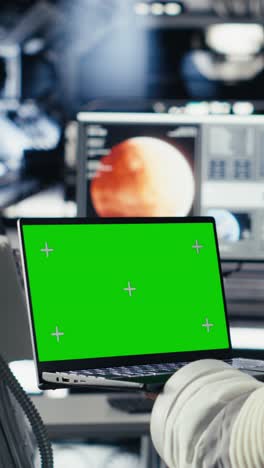 vertical video astronaut studying cosmic origins talks with earth command center